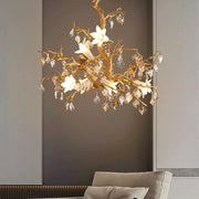 Gold floral copper branch chandelier with crystal accents and white flowers for elegant indoor lighting