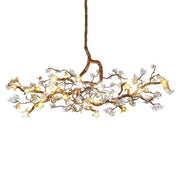 Copper branch pendant chandelier with warm led bulbs and white blossoms for elegant living room decorbites copper branch lighting