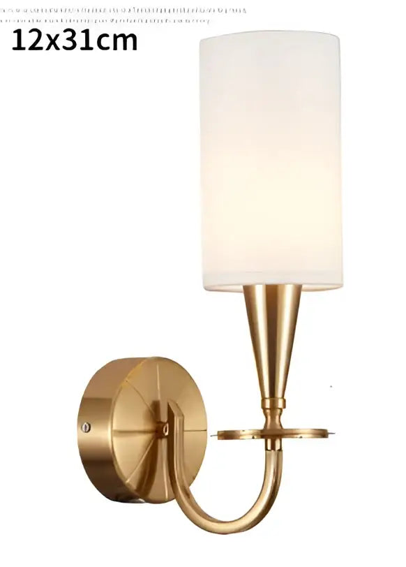 Brass-finished wall sconce with cylindrical frosted glass shade complementing decorbites copper ceiling chandelier for living room decor