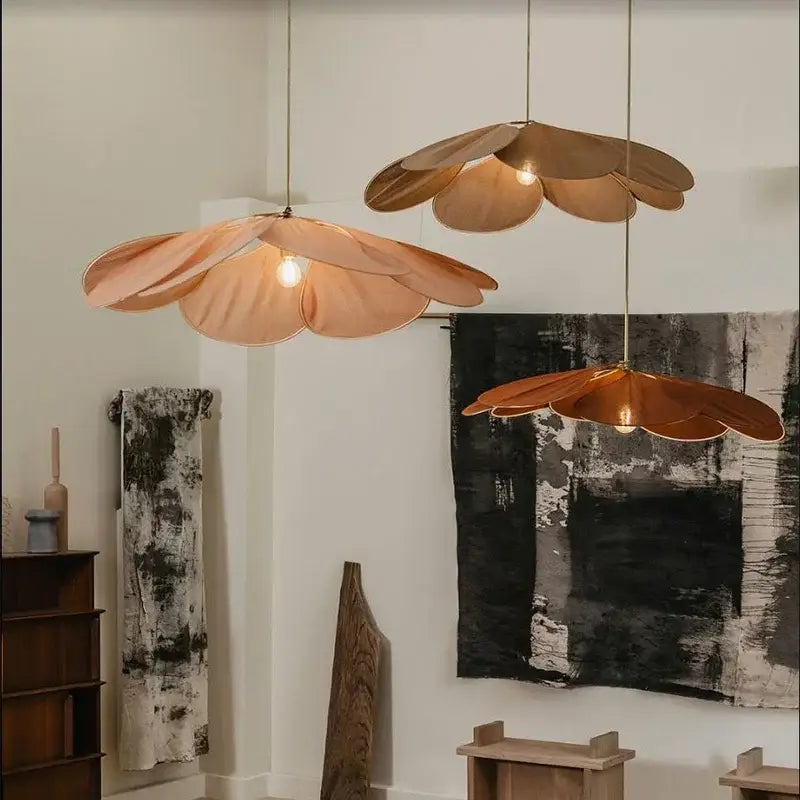 Three copper-toned petal fabric pendant lights from decorbites colorful petal collection for dining room decor