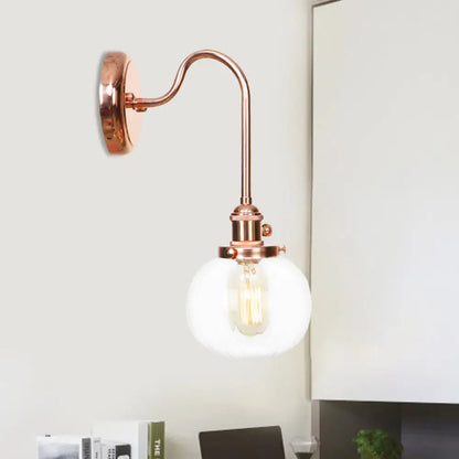 مصباح حائط كروي عتيق من النحاس بذراع منحني وزجاج شفاف/كهرماني - مصباح واحد