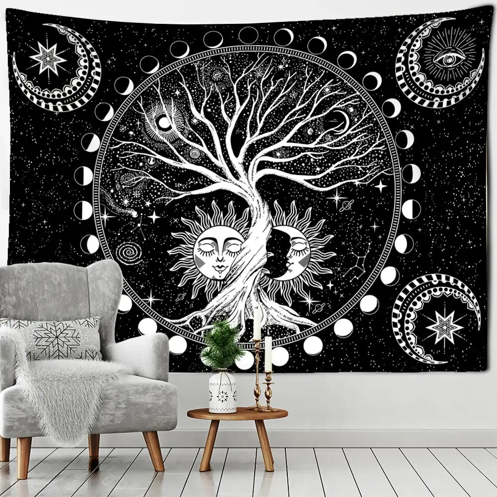Black and white celestial tapestry with green life tree featuring sun moon faces phases stars and eye symbol wall hanging