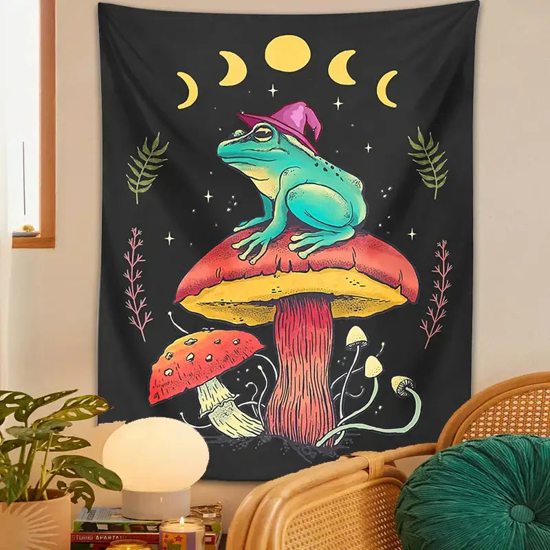 A cottagecore frog on mushroom tapestry wall hanging with a teal frog in a pink hat on a colorful mushroom decorbites frog