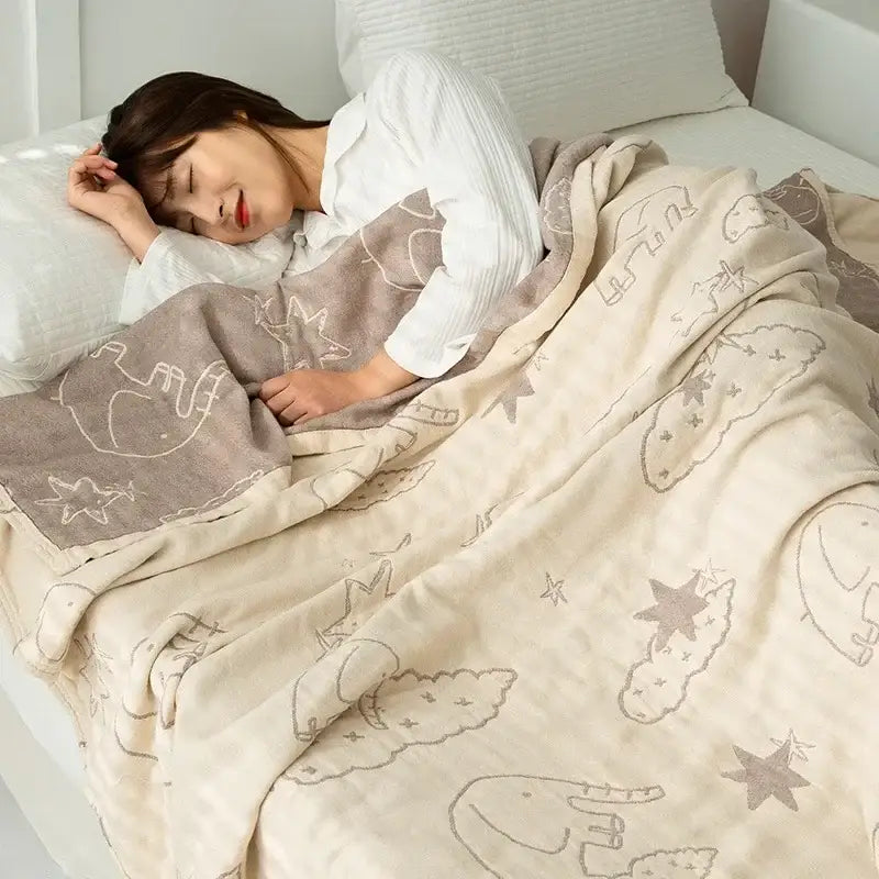 Beige and gray patterned cotton gauze boho throw with whimsical elephant cloud and star designs for bedroom decorbites cotton gauze