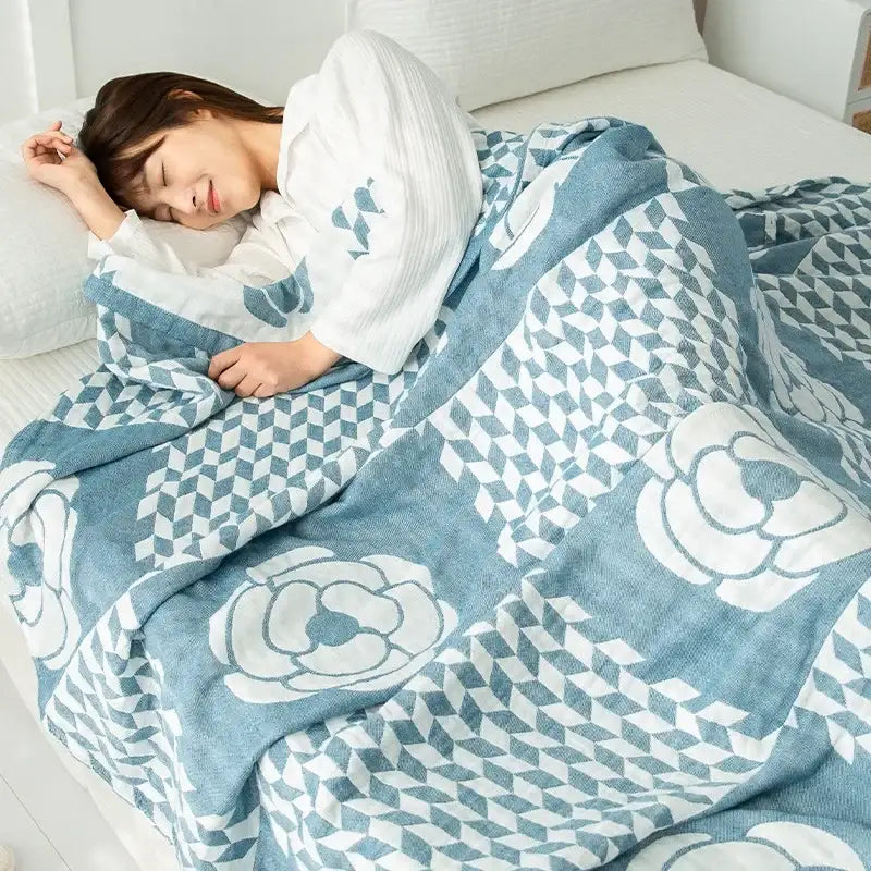 Blue and white patterned cotton gauze boho throw with floral and geometric designs for bedroom decorbites cotton gauze