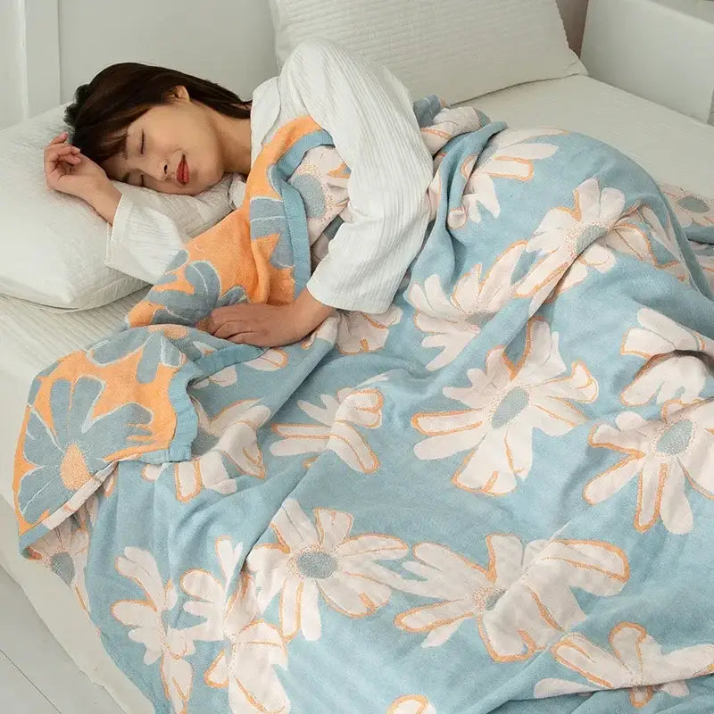 Light blue decorbites cotton gauze boho throw with white and orange floral pattern soft cotton material