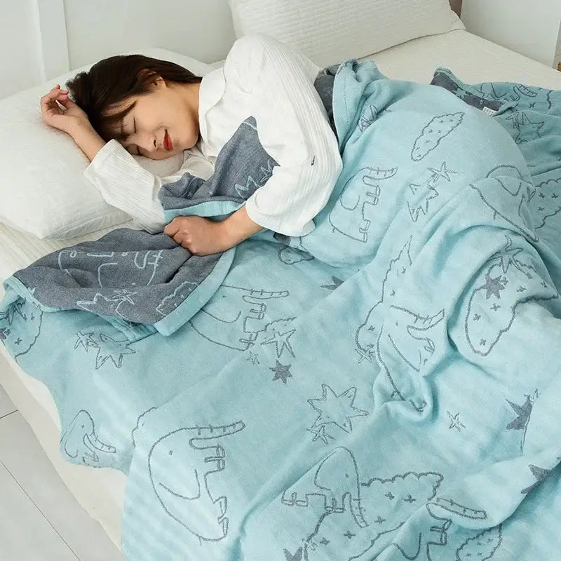 Light blue cotton gauze boho throw with gray elephant and star patterns soft textured surface for cozy decorbites use