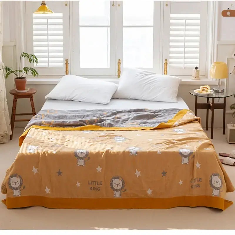 Soft mustard-yellow cotton gauze boho throw with playful lion pattern and little king text for cozy decorbites cotton gauze decor