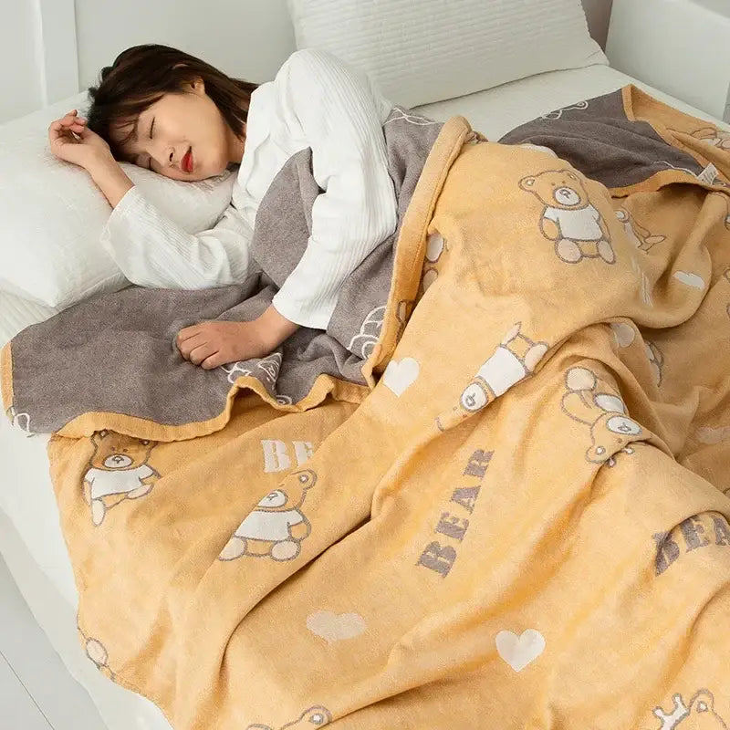 Soft yellow cotton gauze boho throw with gray bear and heart patterns featuring cozy fleece texture from decorbites cotton gauze