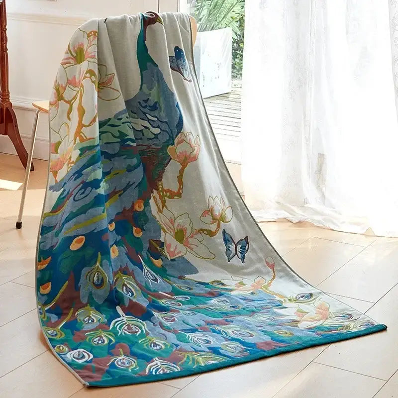 A plush light gray cotton gauze peacock bath towel with teal feathers pink blossoms and black butterflies decorbites cotton gauze