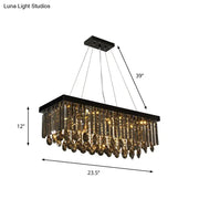 Black crystal island pendant light with cascading gold-toned crystal droplets for dining room decorbites