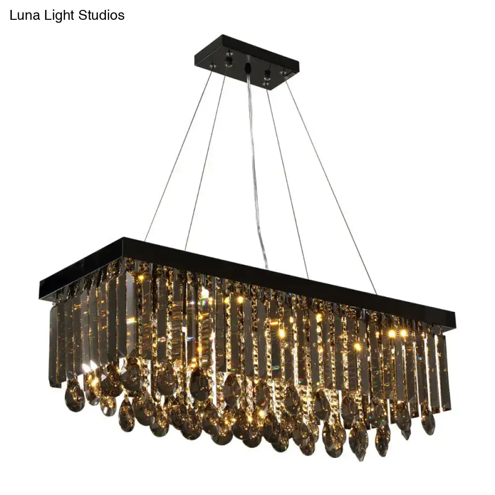 Black rectangular crystal island pendant light with hanging crystal prisms and amber glass for dining room decor