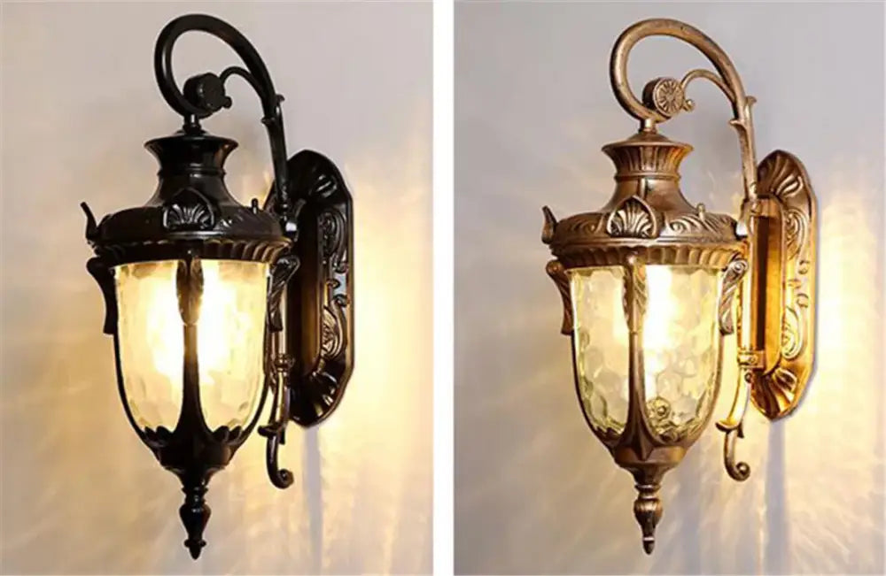 Antique-style country black wrought iron outdoor wall lantern with ornate metalwork and frosted glass panels