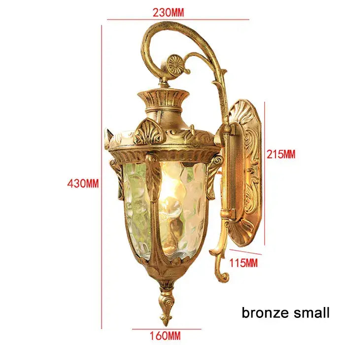 Bronze-finished country black wrought iron outdoor wall lantern with ornate scrollwork and textured glass for restaurant light