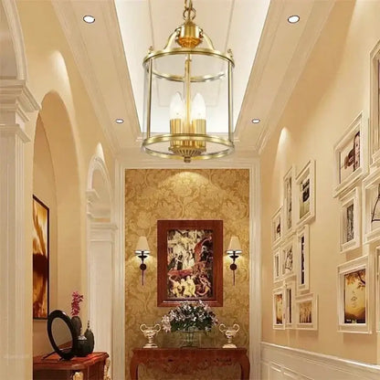 Brass lantern ceiling fixture with clear glass panels and three exposed bulbs in decorbites bronze glass pendant lights