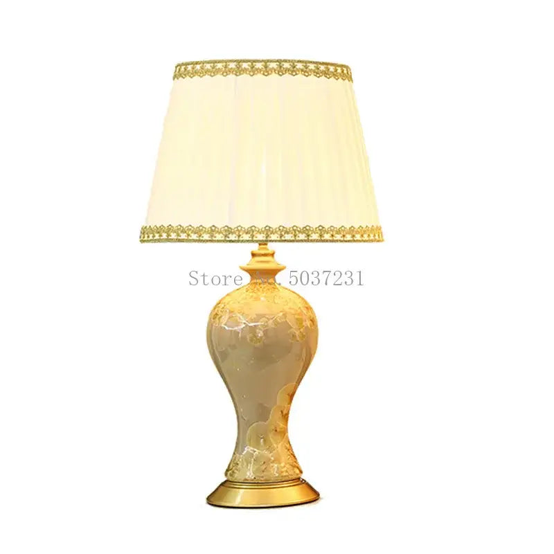 Elegant cream-colored country ceramic table lamp with gold accents and lace-trimmed shade for decorbites bedroom decor