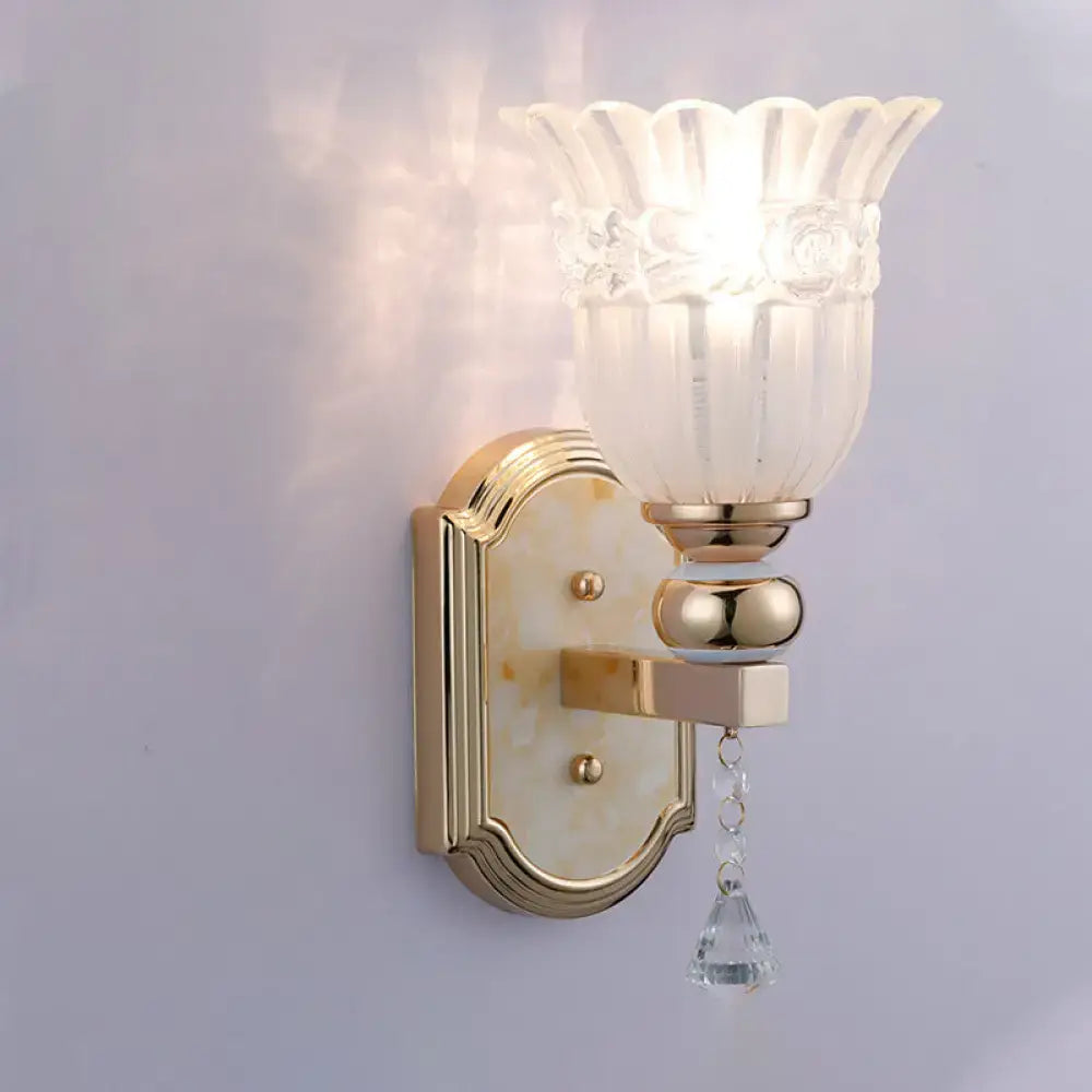 Country gold frosted glass floral wall sconce lamp with gold finish and dangling crystal teardrop for bedroom lighting