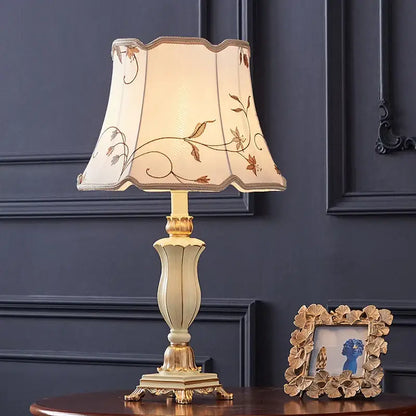 Cream-colored desk lamp with gold accents and embroidered floral shade from decorbites country pastoral desk collection