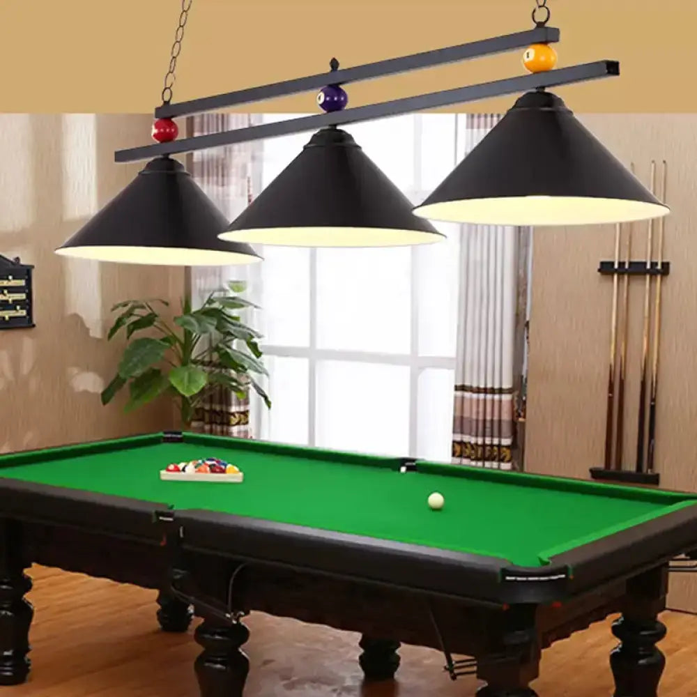 Black three-light pool table lamp with cone shades and decorative billiard balls for bar island lighting fixture