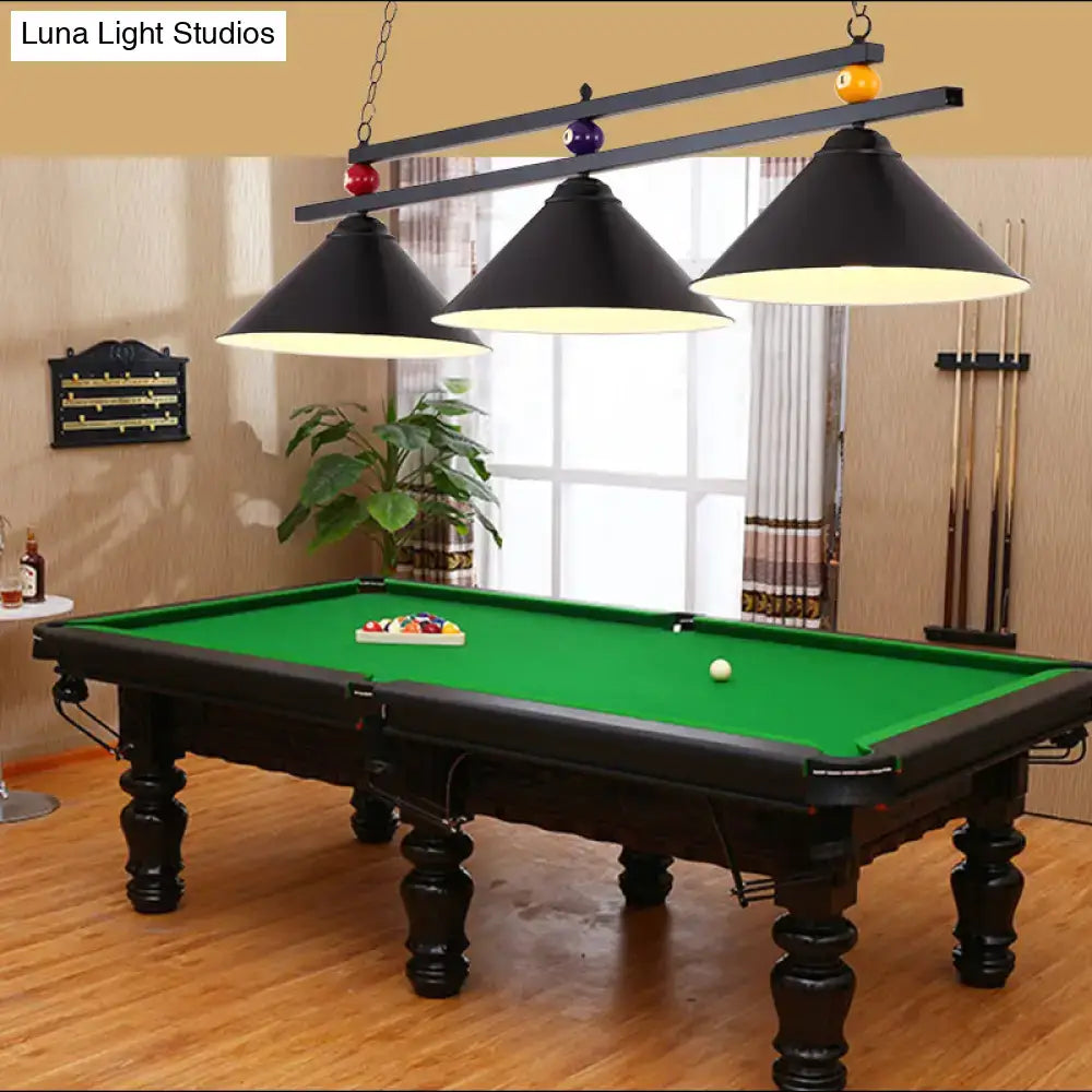 Black wrought iron pool table with green felt and ornate legs complementing country style dark green bar island lighting fixture chain cord length adjustable