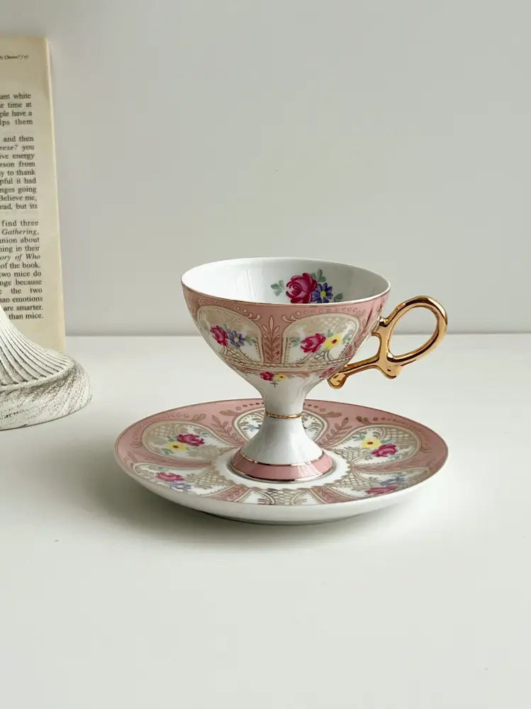 A delicate pink and white porcelain cup set with floral patterns and gold handle from Decorbites court style collection