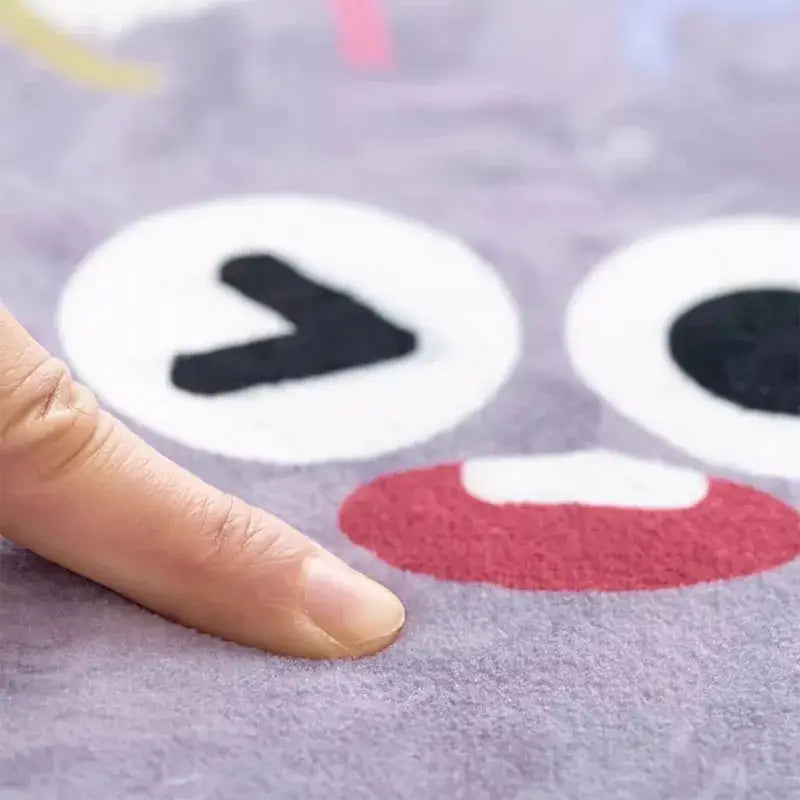 Cozy carpet soft lavender plush rug with decorbites cartoon ball print featuring black felt eyes and red mouth