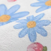 Cozy carpet white bedroom rug with plush texture and embroidered light blue daisies featuring cartoon ball print decorbites