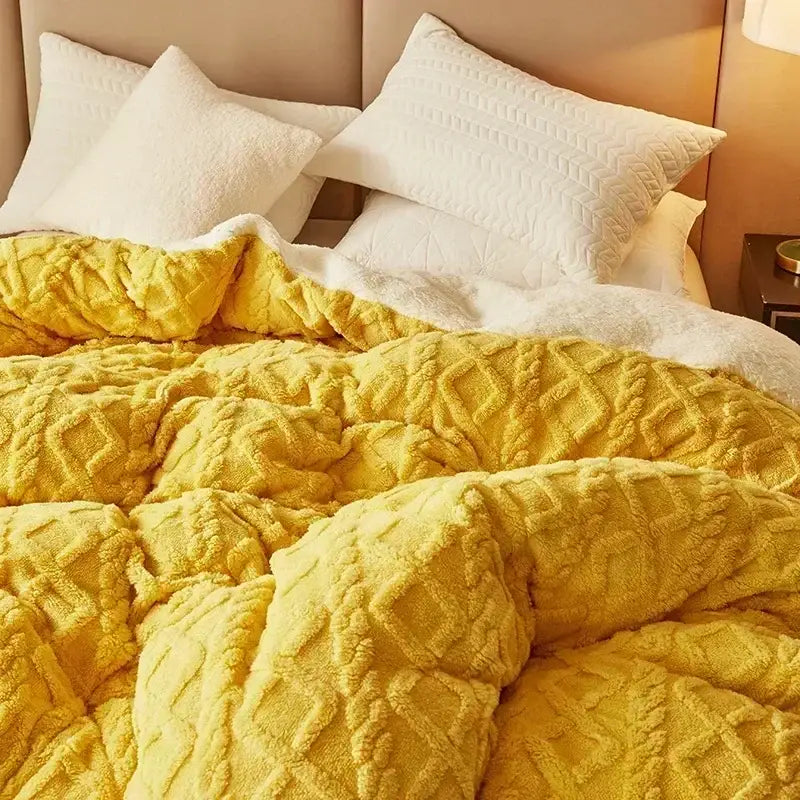 Cozy cashmere blanket duvet in mustard yellow with quilted texture and white sherpa fleece duvet cover