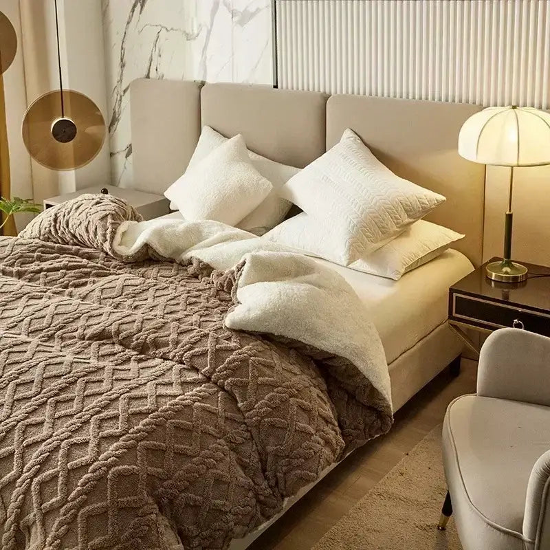 A cozy cashmere blanket duvet cover featuring a brown textured knit with diamond pattern and plush white lining