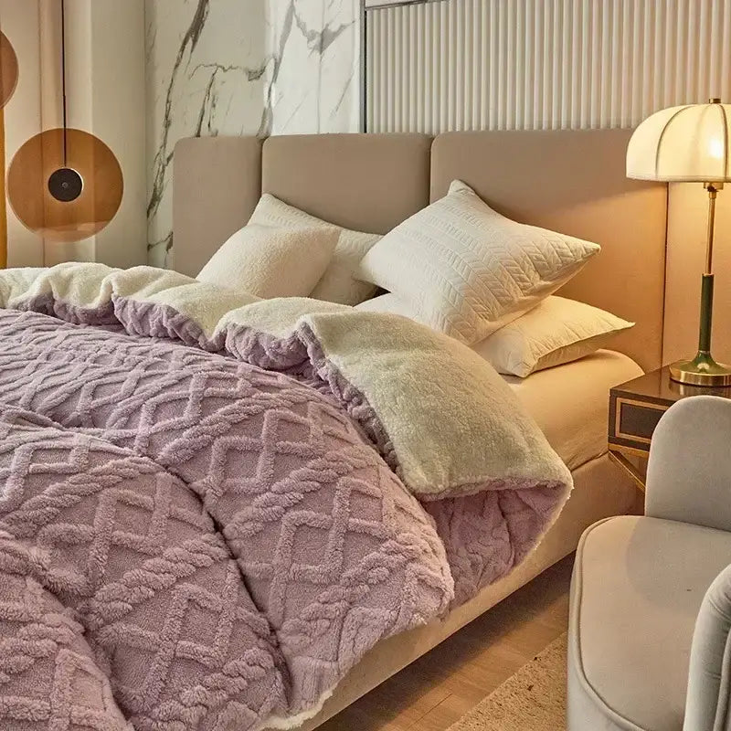 A cozy cashmere blanket duvet cover in lavender fleece with a textured diamond pattern and white lining