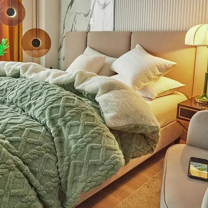 Soft mint green textured fleece cozy cashmere blanket duvet cover with diamond pattern draped over bed