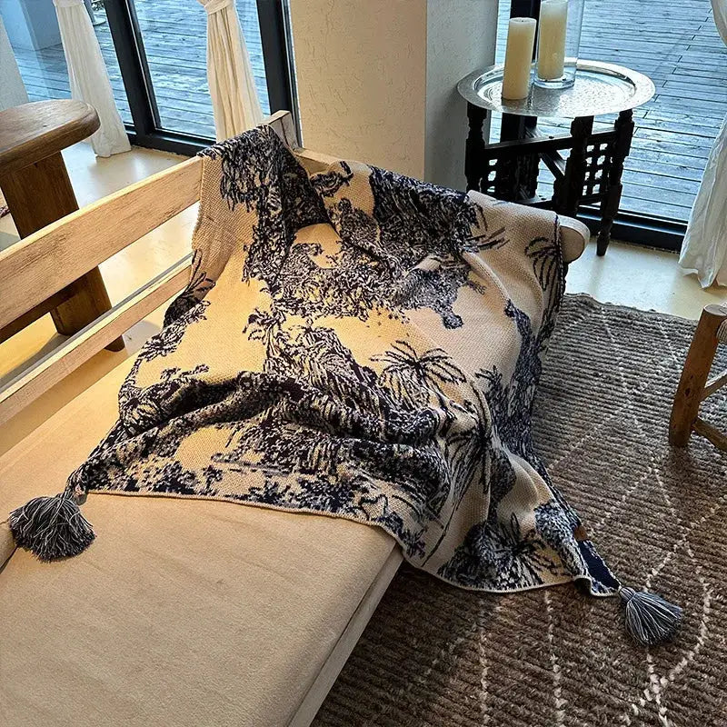 Beige and black patterned knit throw blanket with tassels at each corner for decorbites cozy chinese ink bedroom decor