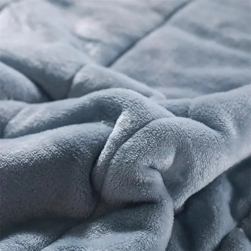 Soft plush gray fleece blanket with cozy textured surface complementing decorbites cozy coral fleece quilt