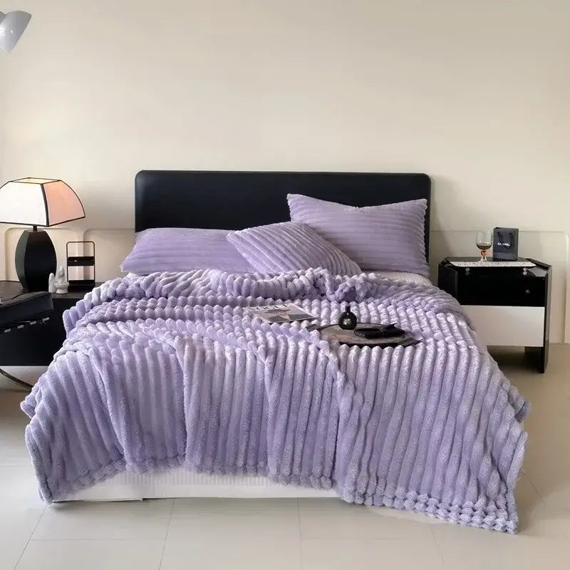 Lavender plush ribbed throw blanket with soft textured surface made from cozy coral fleece for decorbites cozy coral use