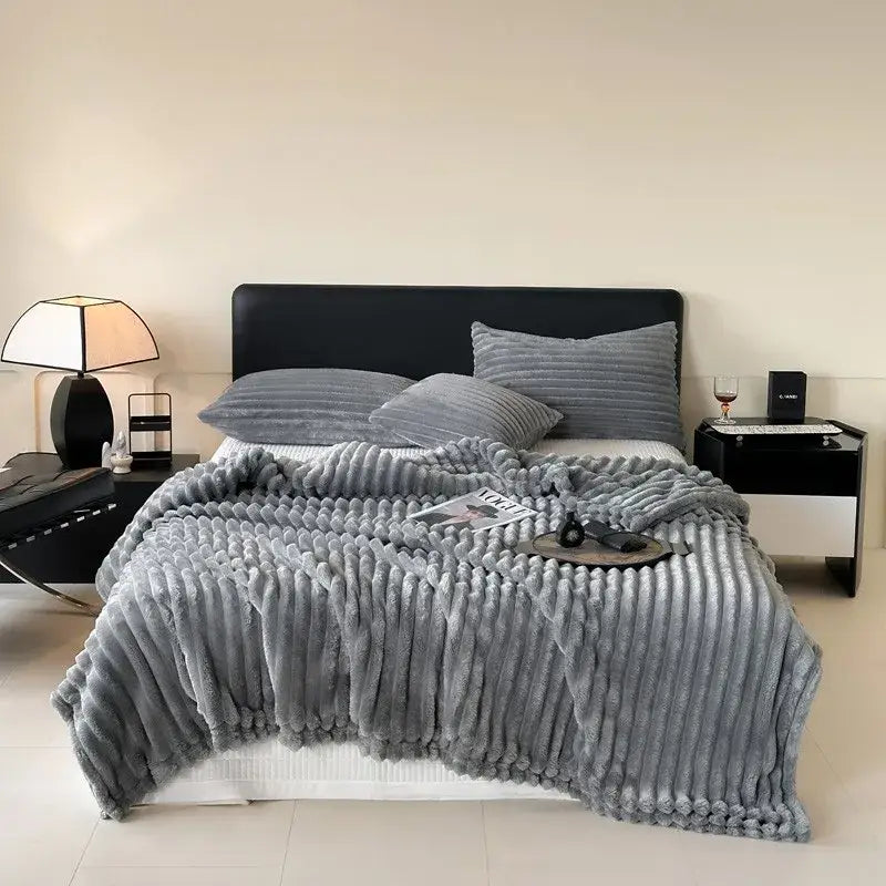 Gray corduroy throw blanket with plush textured surface and ribbed stripes for decorbites cozy coral fleece collection