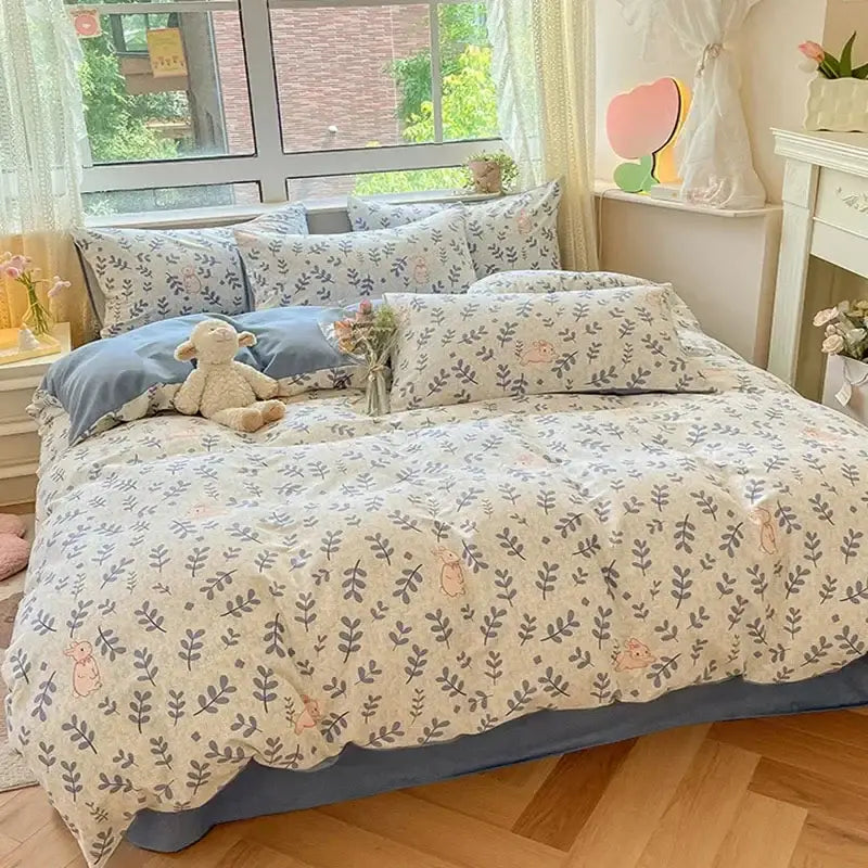 Cozy cotton bedding set with pastel floral and bunny embroidery in cream base and blue accents by decorbites cozy cotton