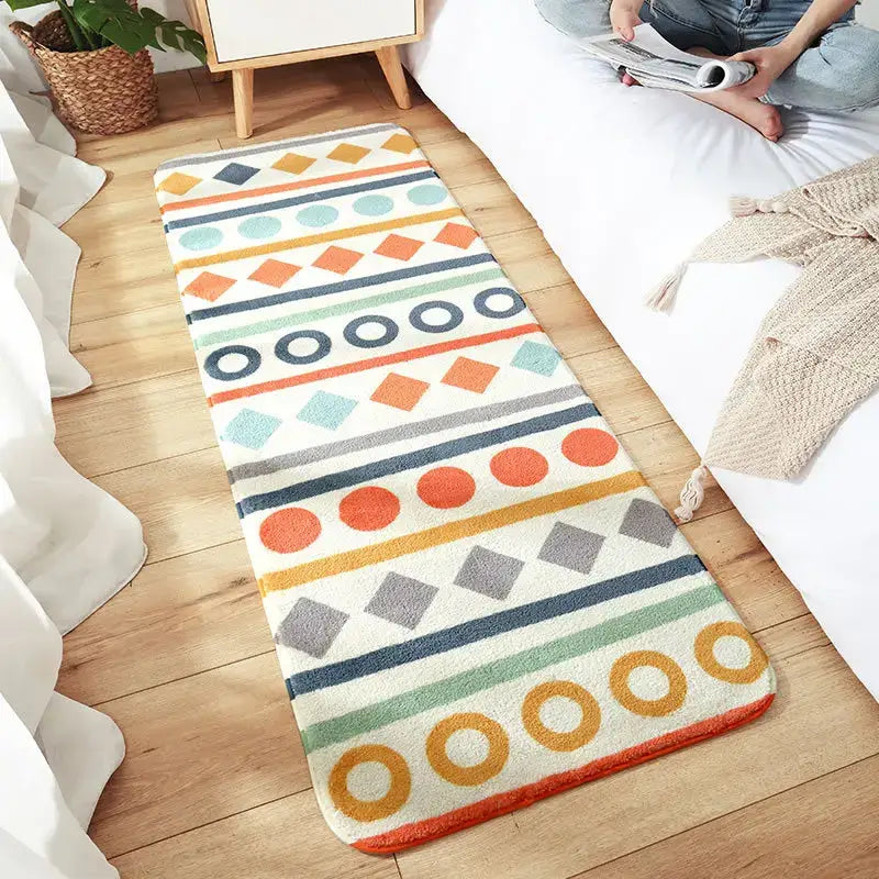 Colorful geometric-patterned cozy faux lamb bedside rug with plush texture in orange teal gray and cream stripes