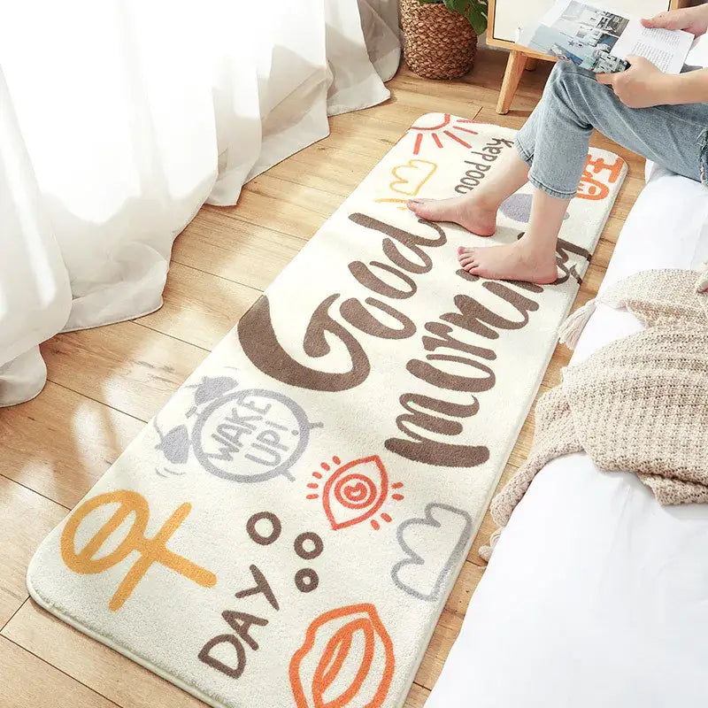 Cream-colored cozy faux lamb wool bedside rug with brown good morning script and orange gray sun alarm clock decorbites cozy faux