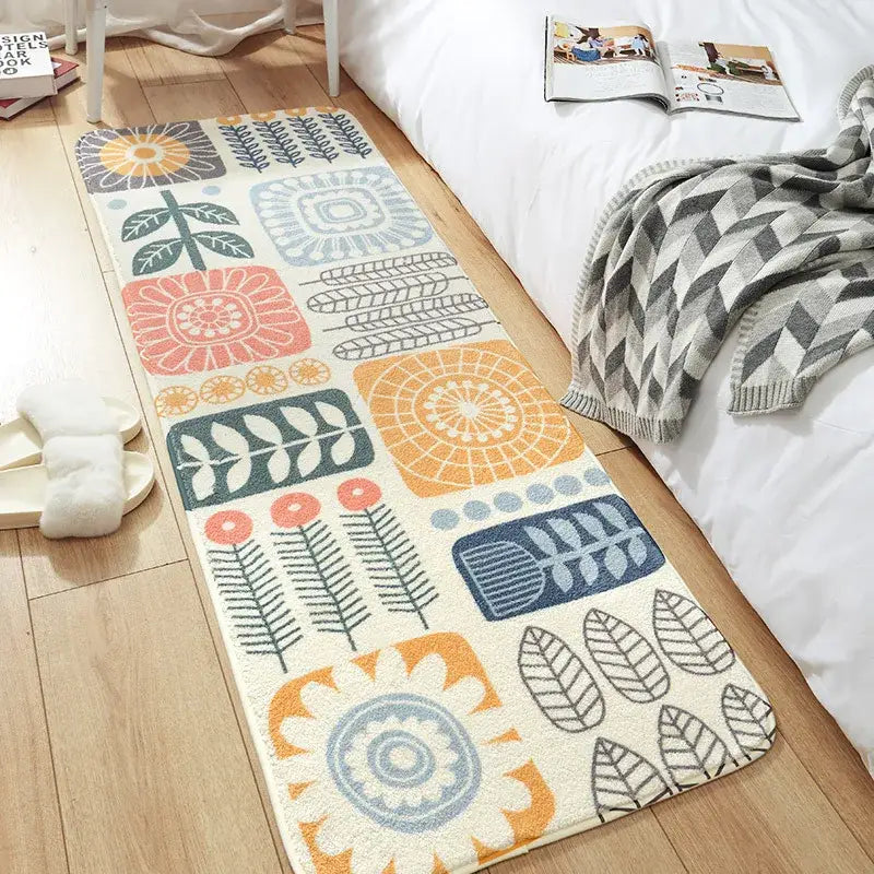 Cozy faux lamb wool bedside rug with colorful geometric and botanical pattern in orange pink blue green and gray tones