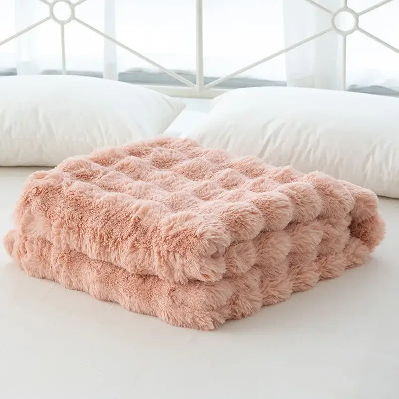 A cozy faux rabbit velvet blush pink plush throw blanket with quilted texture for bedroom decorbites cozy faux use