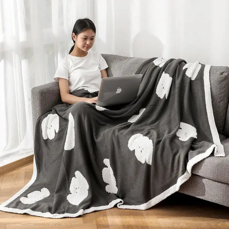 Gray cozy flannel blanket with white fluffy puppy faces and matching white border by decorbites cozy flannel