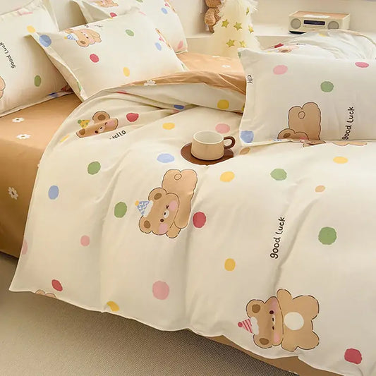 Cream-colored bedding set with cozy flower print featuring brown teddy bears in party hats and pastel polka dots decorbites cozy flower