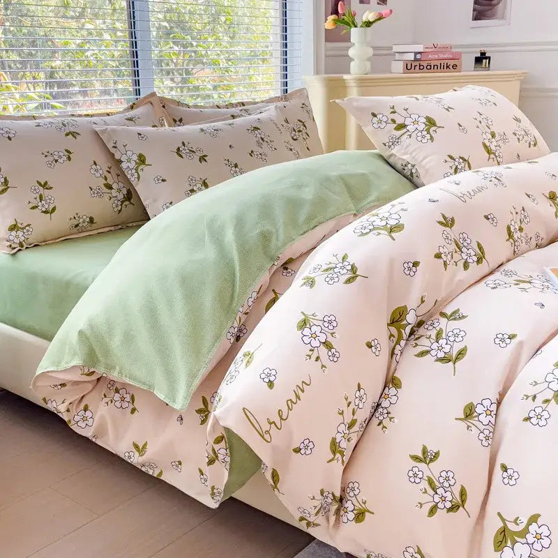 Pastel pink and mint green cozy flower print bedding set with cream teddy bear decor and gold dream script on duvet cover