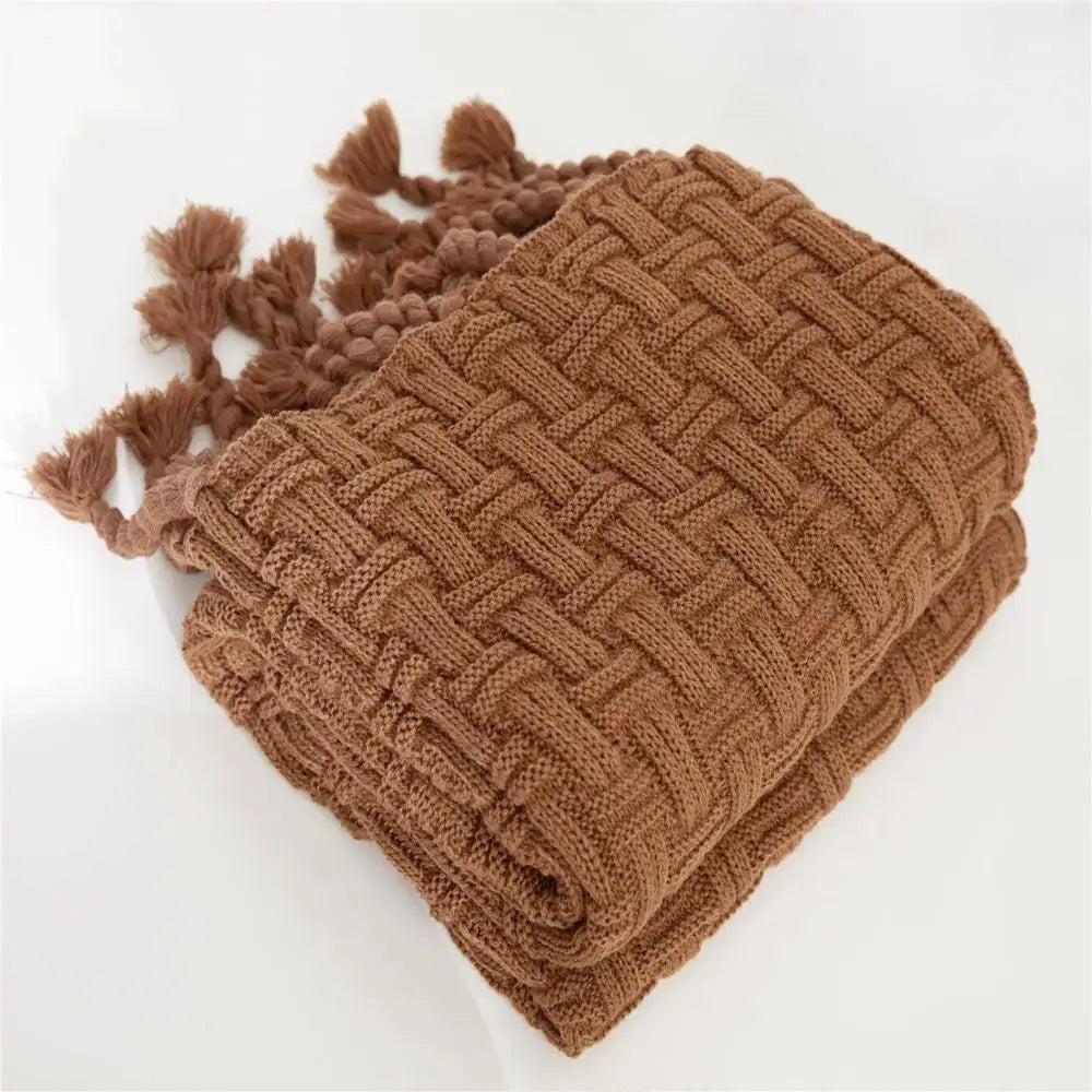 A cozy fringed plaid rust-colored knitted throw blanket with woven texture and tassels for bedroom decorbites cozy fringed use