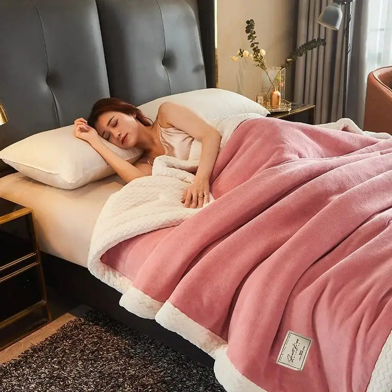 Pink and white plush fleece blanket with a soft textured surface ideal as a cozy winter fleece blanket for bedrooms