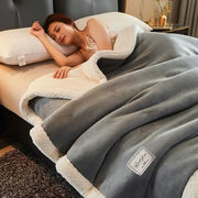 Soft gray fleece blanket with cream textured fleece border perfect for cozy winter fleece use in the bedroom