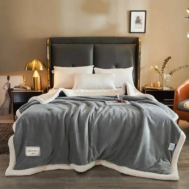 Cozy gray fleece blanket with soft white fleece lining and subtle stitching ideal for winter fleece use