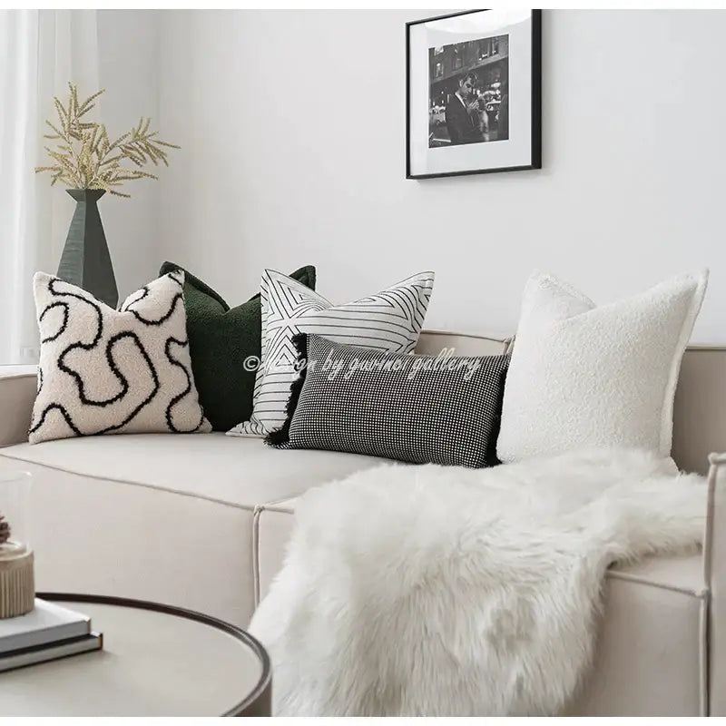 A cozy green handmade pillow cover with plush textured decorbites designs including embroidery and checkered patterns