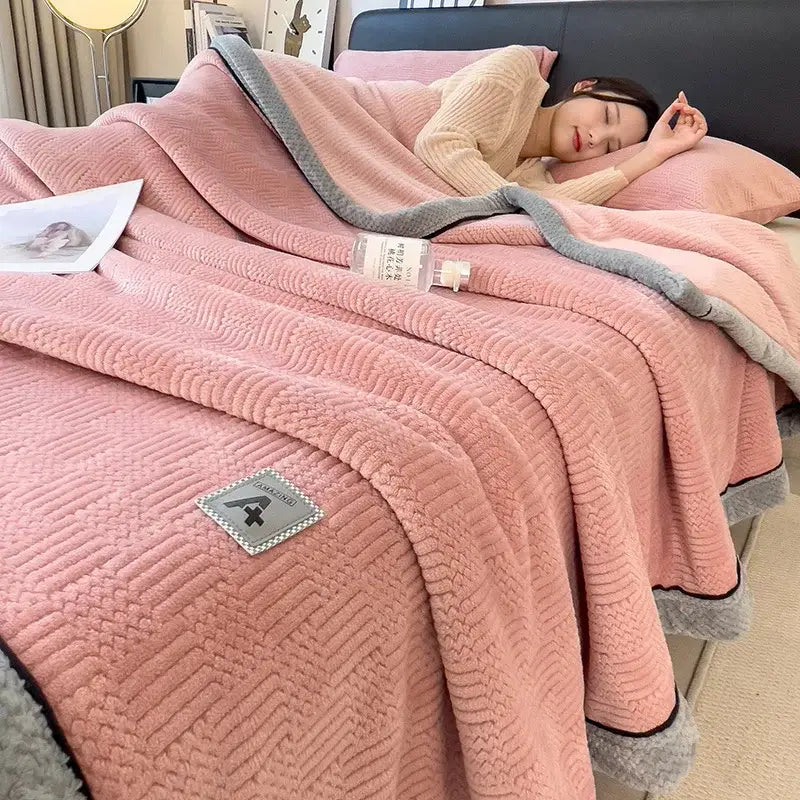 Pink plush cozy jacquard plush blanket with gray border and textured weave featuring decorbites cozy jacquard patch