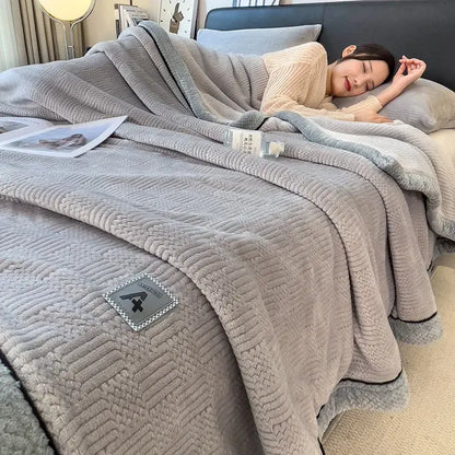 Soft gray cozy jacquard plush blanket with textured surface and black piping for cream and black bedroom decorbites cozy jacquard